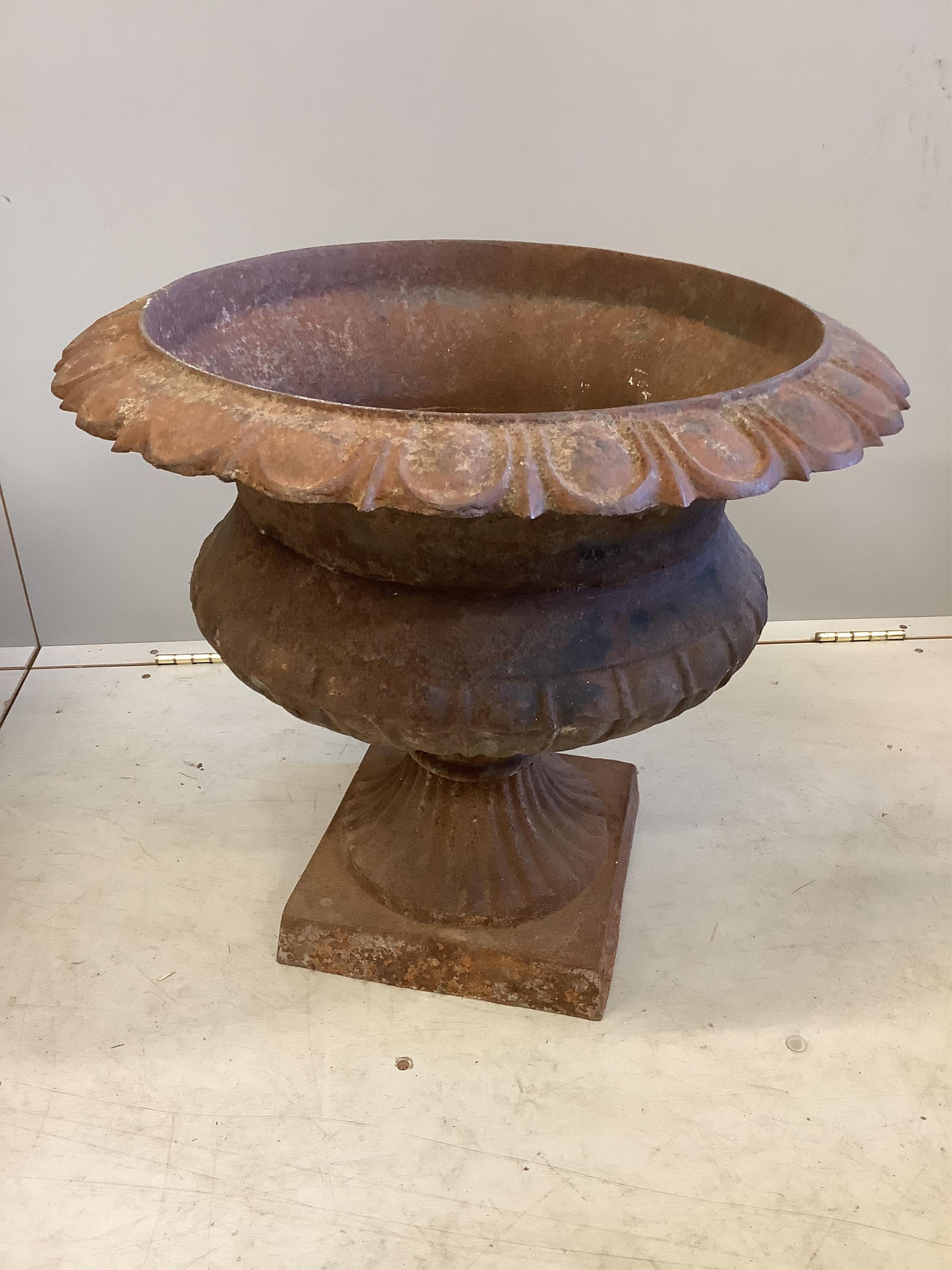 A pair of Victorian cast iron campana garden urns, diameter 60cm, height 53cm
